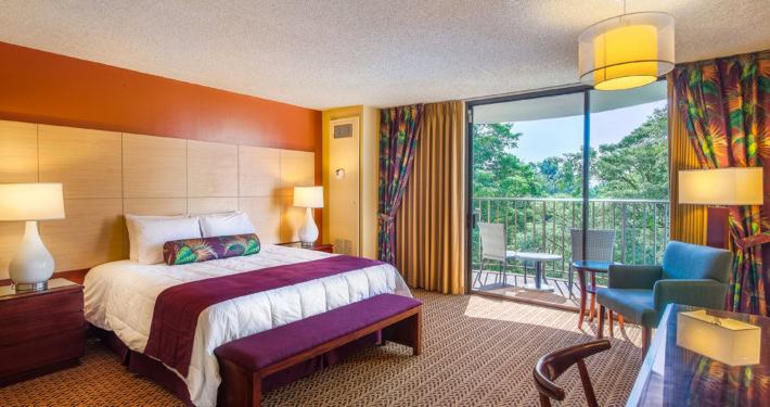 Superior room with bed and private lanai with seating